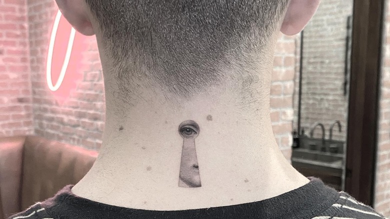 Joe Jonas' neck tattoo of an eye in a keyhole