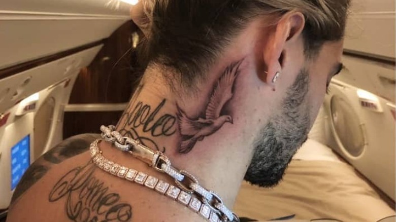 Singer Maluma displaying his neck tattoos