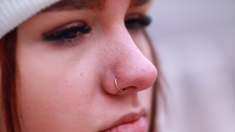 Woman with gold hoop in nose