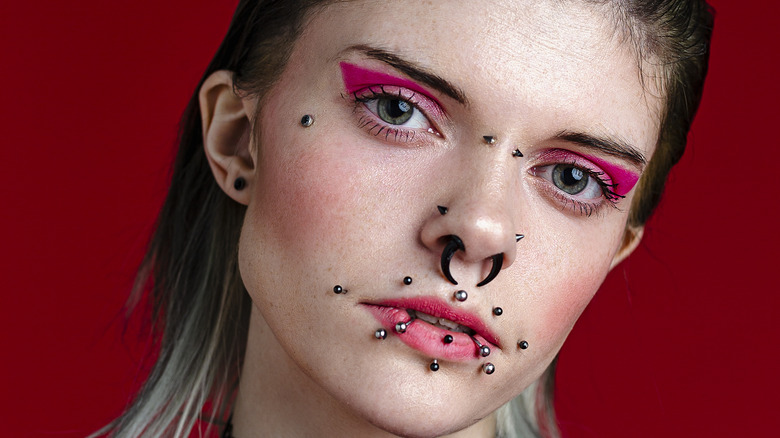 Woman with multiple facial piercings