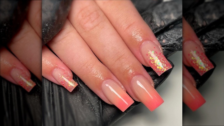 Peachy pink ombré nails with glittery tips