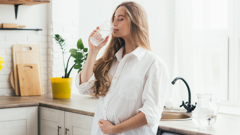 Pregnant woman drinking water