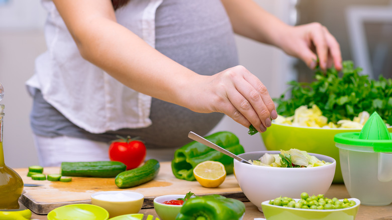  Pregnant woman cooking