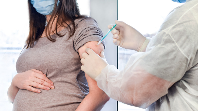 Pregnant woman getting vaccine