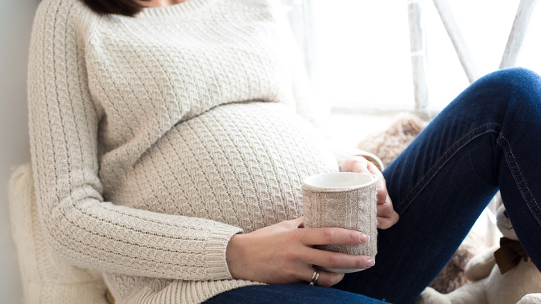 Pregnant woman drinking tea