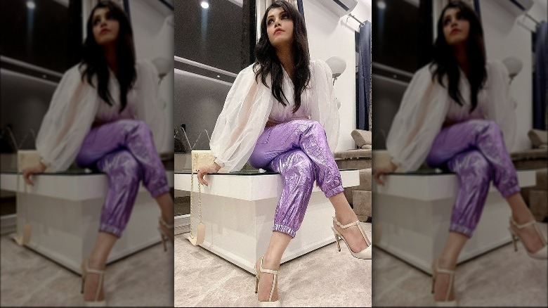 Brunette in purple metallic pants