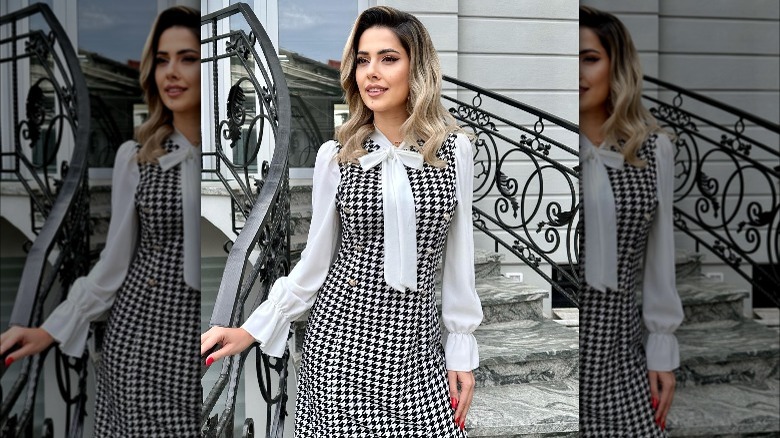 Woman in a black and white houndstooth dress