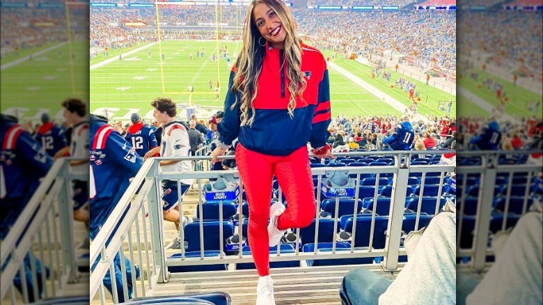 Woman at stadium red leggings