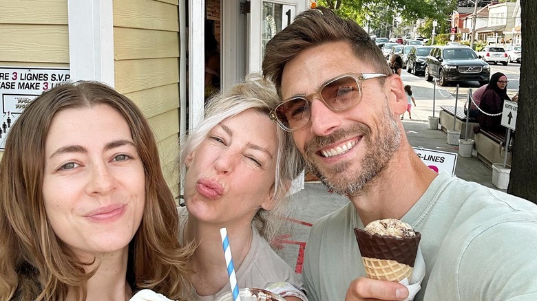 Andrew Walker smiling with ice cream and loved ones