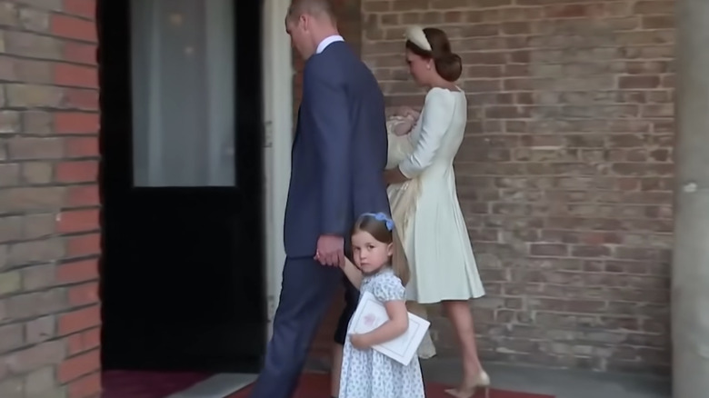 Princess Charlotte walking with parents 