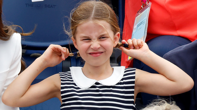 Princess Charlotte playing with pigtails