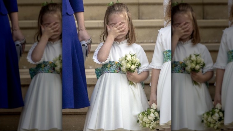 Princess Charlotte putting hand to face