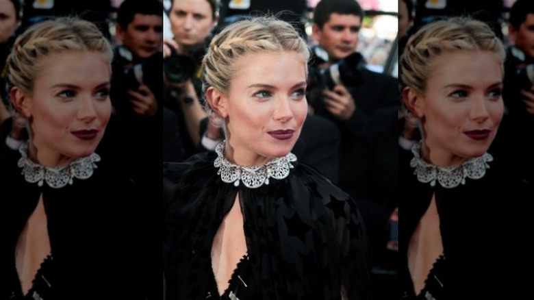 Sienna Miller with messy braided updo