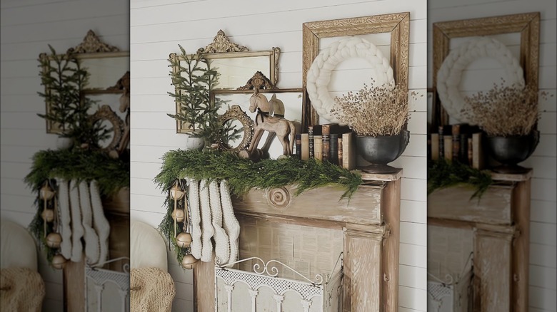 Faux fireplace decorated with beige, vintage Christmas items