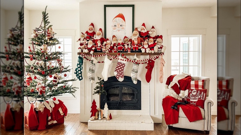 Fireplace decorated with many Santa Claus figures
