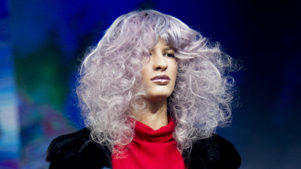 A woman with tousled bangs