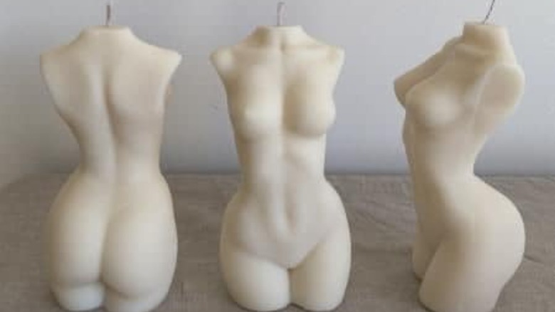 Naked female torso-shaped candles