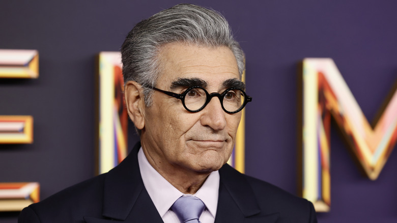 Eugene Levy posing on Emmys step-and-repeat