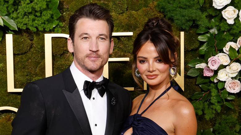 Miles Teller and Keleigh Sperry posing at the Golden Globes