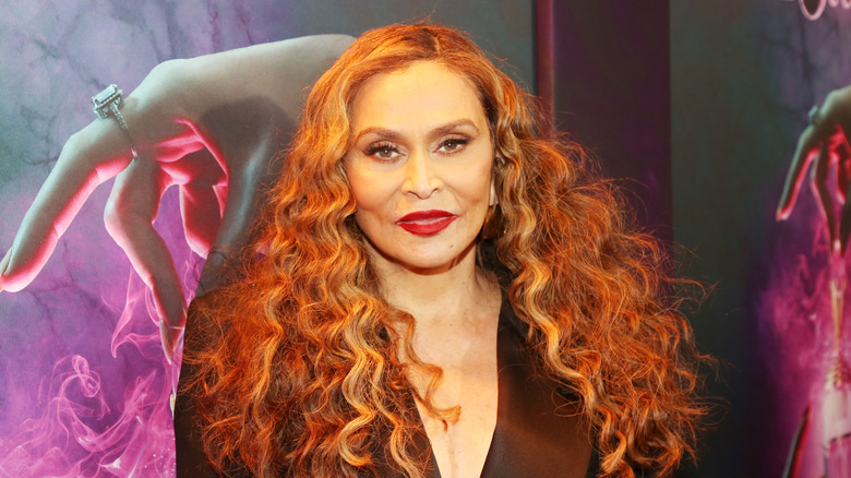 Tina Knowles posing at event