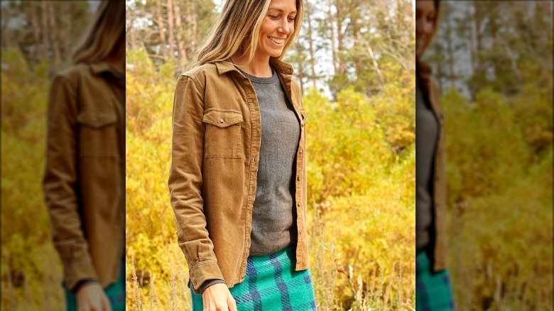 Blond woman in a tan corduroy shirt