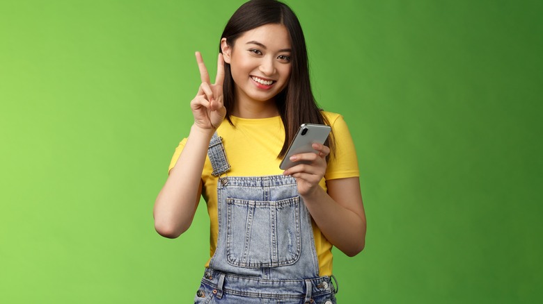 Young woman's peace sign