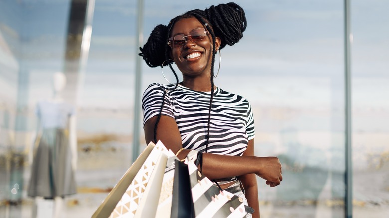 Woman smiling with shopping bags