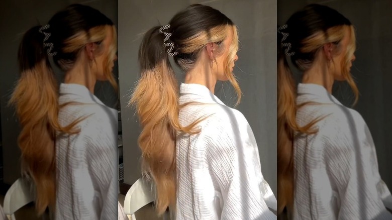 Woman with a long ponytail in a claw clip