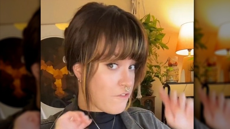 Woman with bangs wearing a hair clip