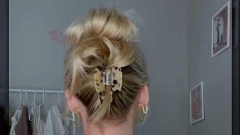 A double bun in a claw clip