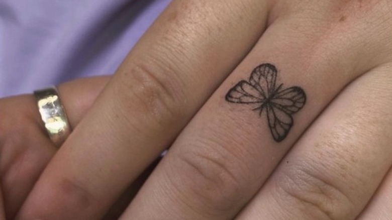 Hand with butterfly tattoo