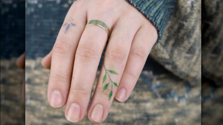 Hand with leaf tattoo