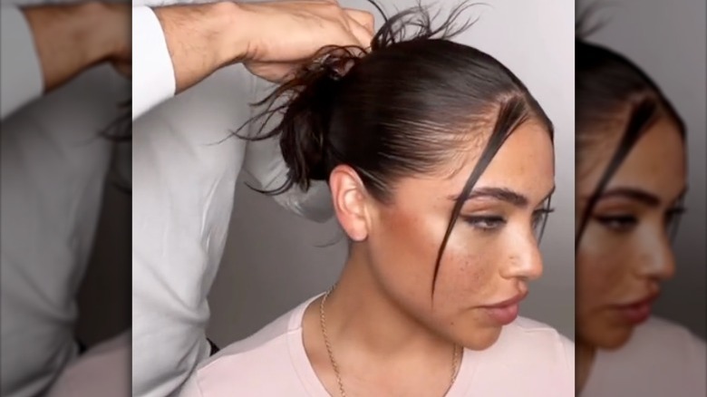 middle part bun tutorial on TikTok