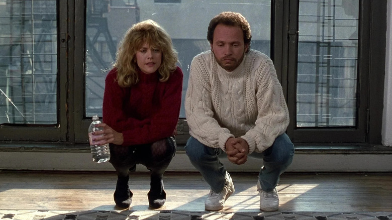 Harry and Sally squat in turtlenecks in 1989 film still