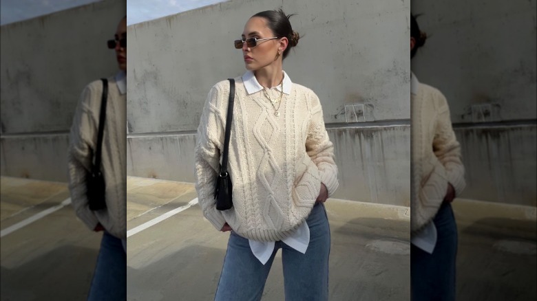 Woman wearing sweater over button-up