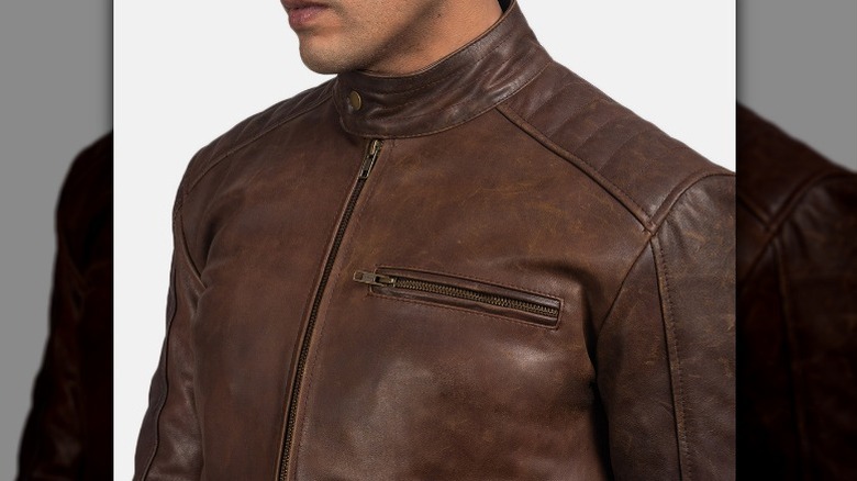 Model wearing brown leather jacket