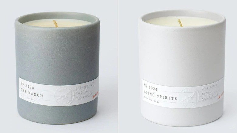 Two candles in minimalist gray containers