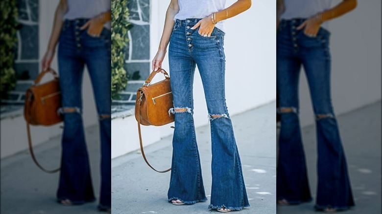 Model wearing dark flared jeans