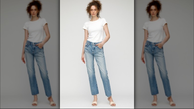 Model wearing faded cropped jeans