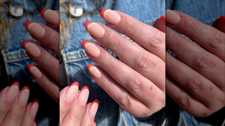 Manicure featuring pastel rainbow French tips