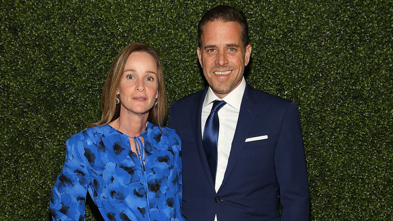 Hunter Biden smiling and Kathleen Buhle pose for a picture at a charity event