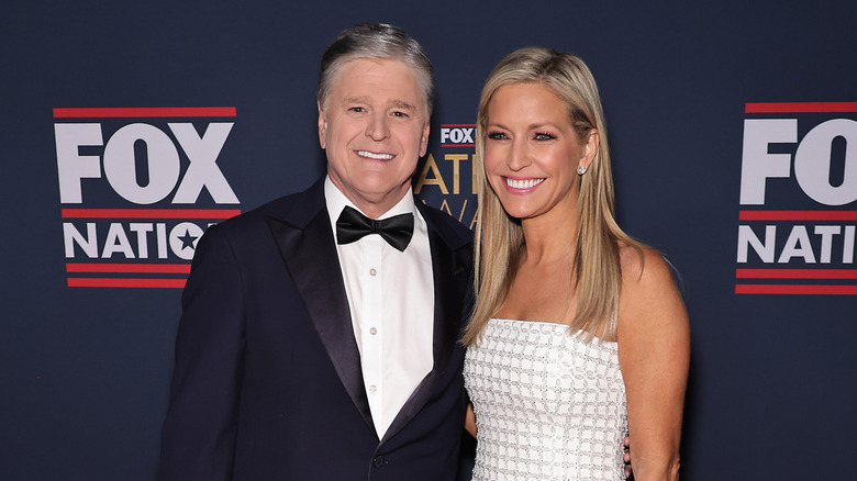 Ainsley Earhardt and Sean Hannity smile as they pose for a picture at the 2024 Patriot Awards