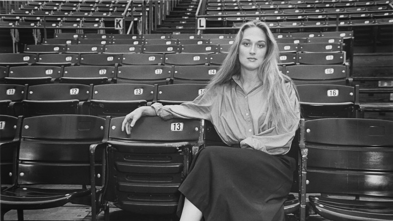 Meryl Streep sits in empty stadium