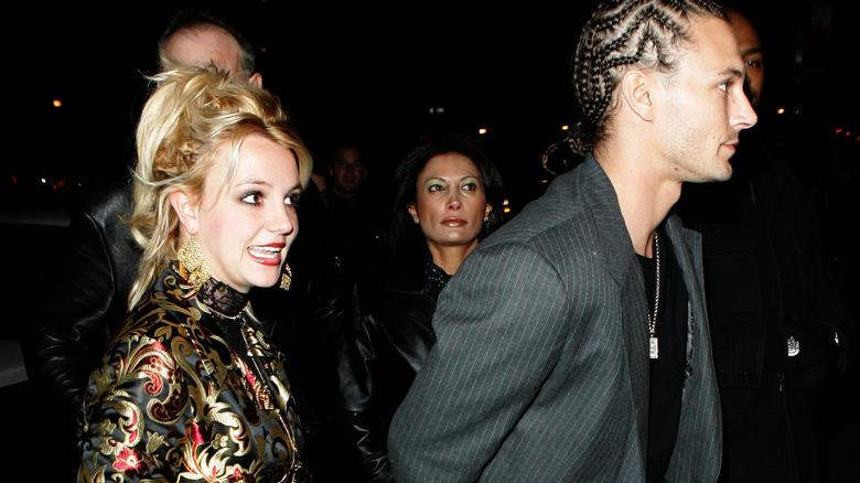 Kevin Federline walks ahead of Britney Spears