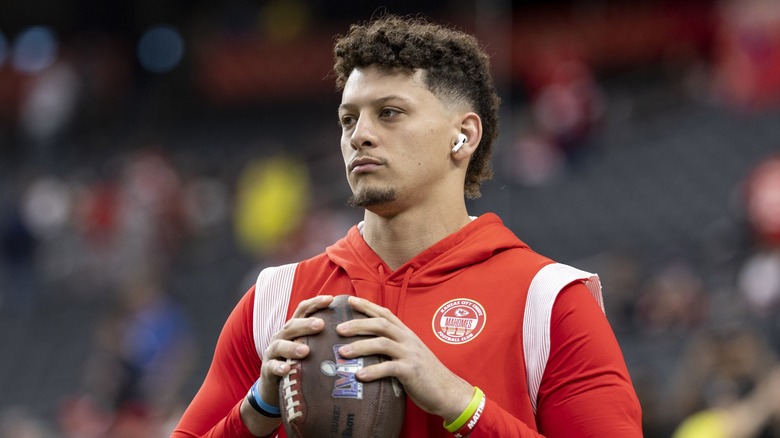 Patrick Mahomes holding football