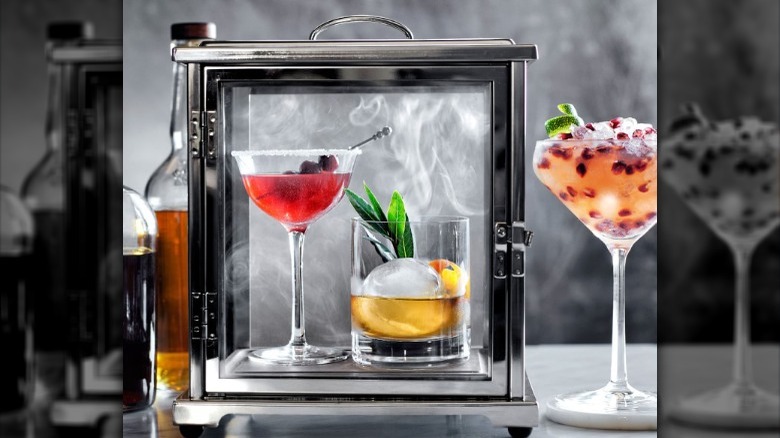 Cocktail smoke box with colorful drinks