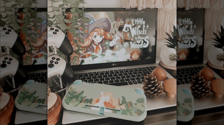 Laptop showing Little Witch in the Woods