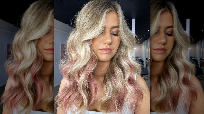 blonde hair with pink streaks along the bottom