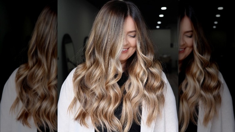 brunette roots with light, medium, and dark blonde