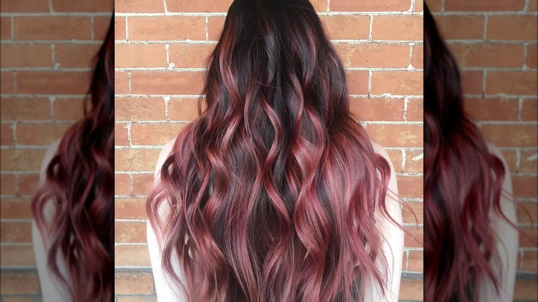 Rear view of long brunette hair with strawberry balayage